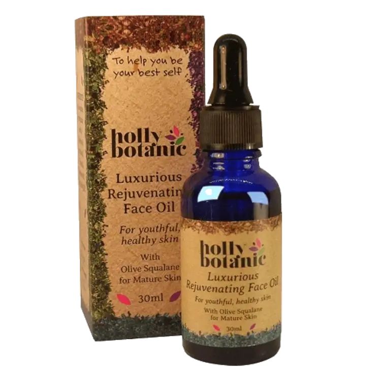 Holly Botanic rejuvenating face oil for mature skin box and bottle. Recyclable cardboard box. 30ml blue, recyclable glass bottle with pipette.