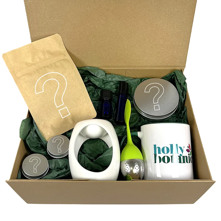 Build your Own Gift Set contains your choice or lip balm, lip scrub, roll on oil, essential oil blend, 20 cup tisane, foot balm, mug, infuser and ceramic oil burner. Presented in a magnetic-close cardboard gift box