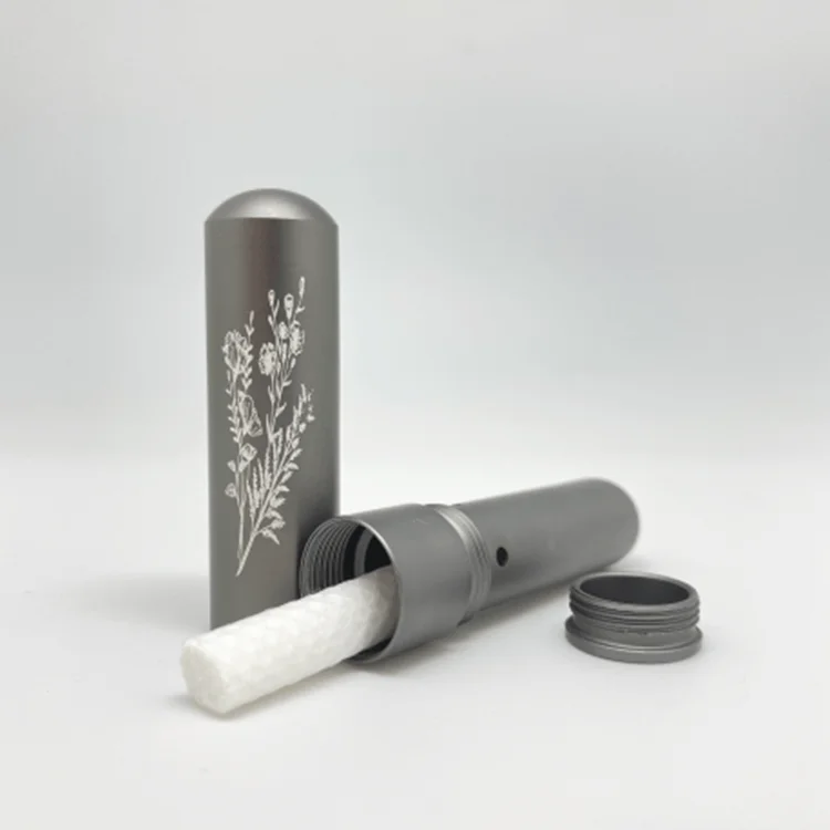 Inhaler personal diffuser for essential oils. Aluminium inhaler in cardboard box. Grey finish with floral pattern.