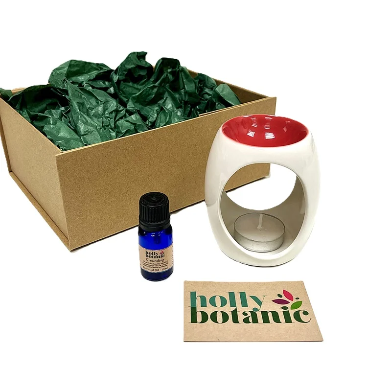 Oil and burner gift set with magnetic-close cardboard box.